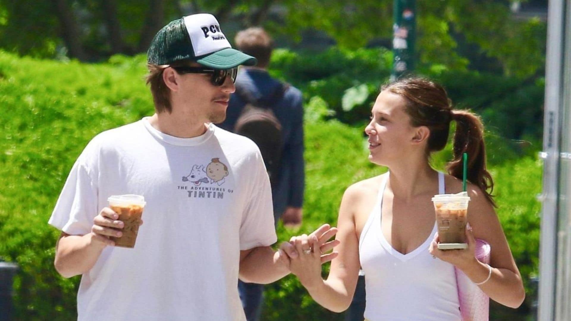 Millie Bobby Brown and Jake Bongiovi share a tender kiss during a romantic stroll