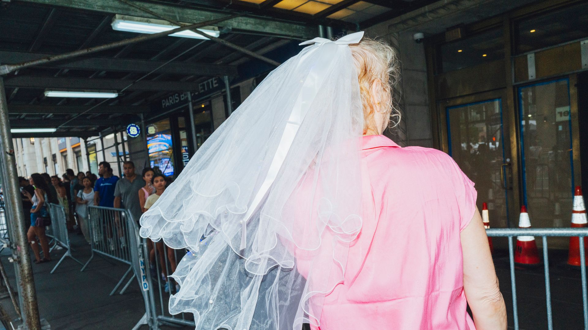 NEW YORK, NY - July 3: Katherine Coy, 51, poses for portraits outsdide outside Madison Square Garden in New York, New York on July 3, 2026. Coy flew to New York from Atlanta. Taylor Swift and Travis Kelce's wedding was reportedly at Madison Square Garden. (Photo by Sara Konradi for The Washington Post via Getty Images)