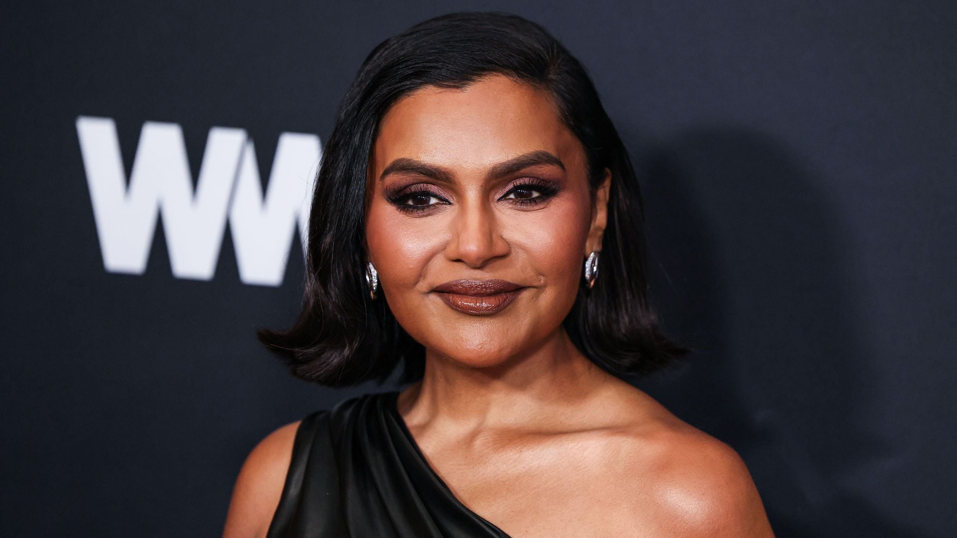 Mindy Kaling stuns in a cut-out gown, highlighting her slimmer silhouette