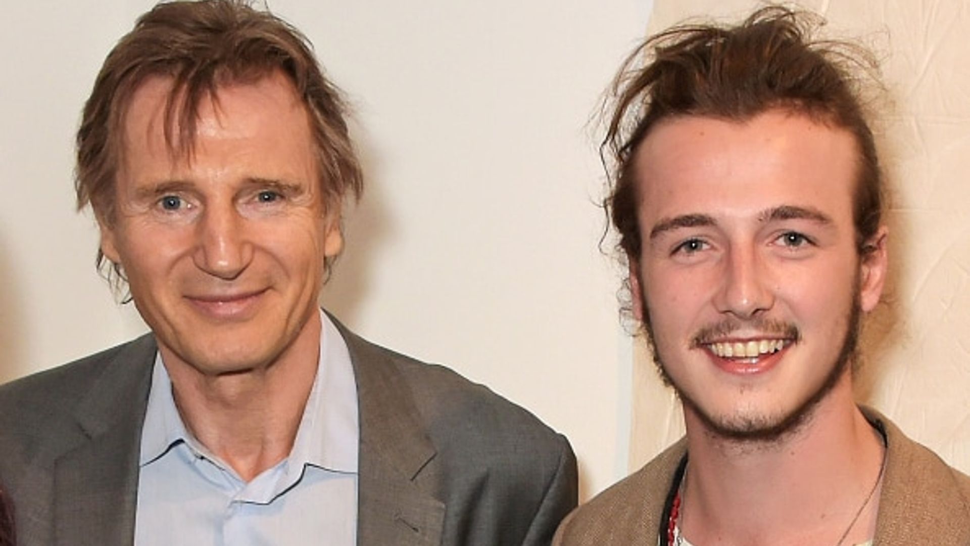 Liam Neeson supports son Micheál at gallery opening