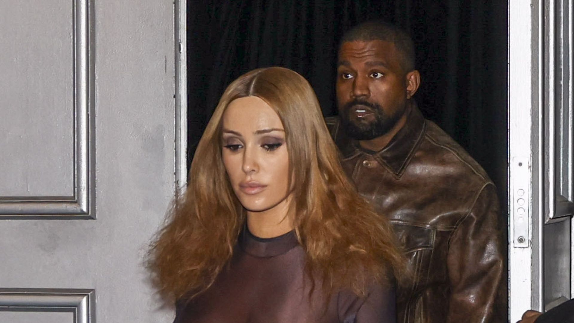 Bianca Censori leaves little to the imagination in completely sheer bodysuit and gold sandals after Kanye West concert