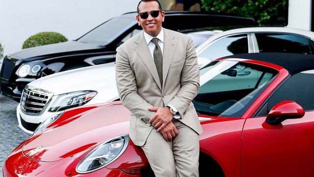 Alex Rodriguez poses with red Porsche he once gifted to Jennifer Lopez