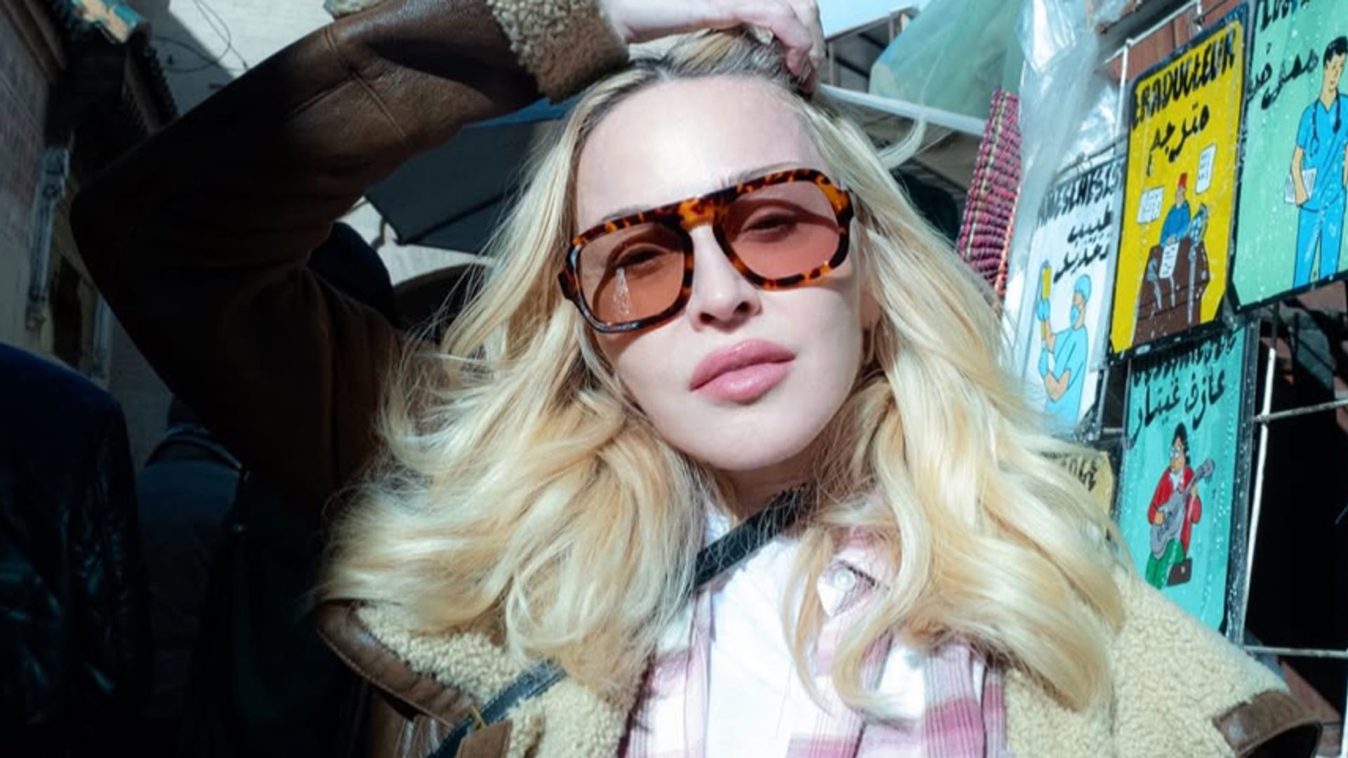 Madonna, 67, turns heads in lace lingerie, fishnet tights, and sheer opera gloves