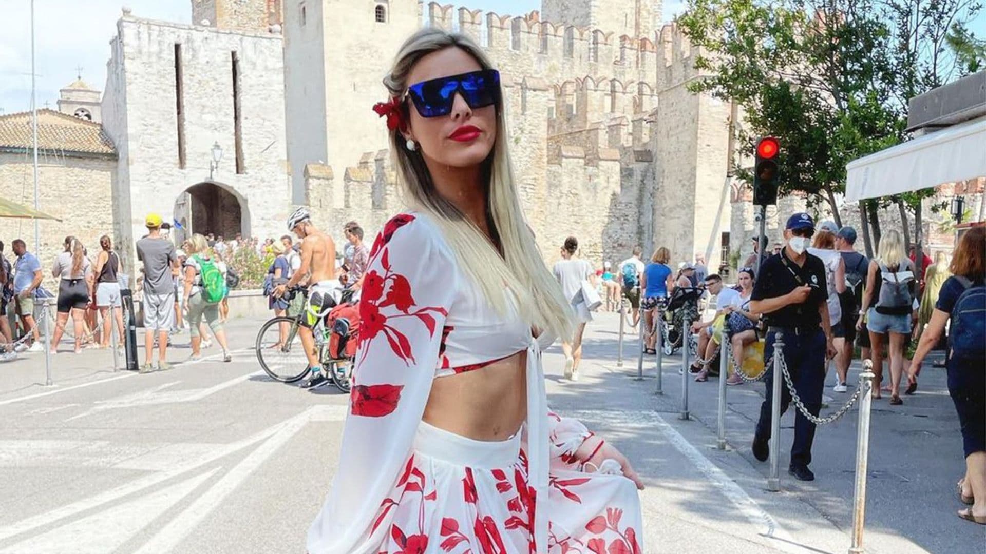 Lele Pons showed off her toned body in a neon orange bikini while holding a pumpkin
