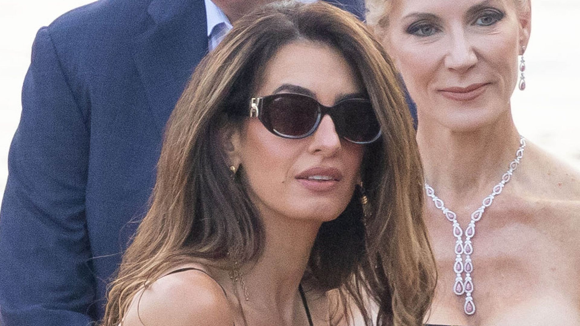 George and Amal Clooney make a rare appearance with twins Ella and Alexander as Amal stuns in elegant black dress