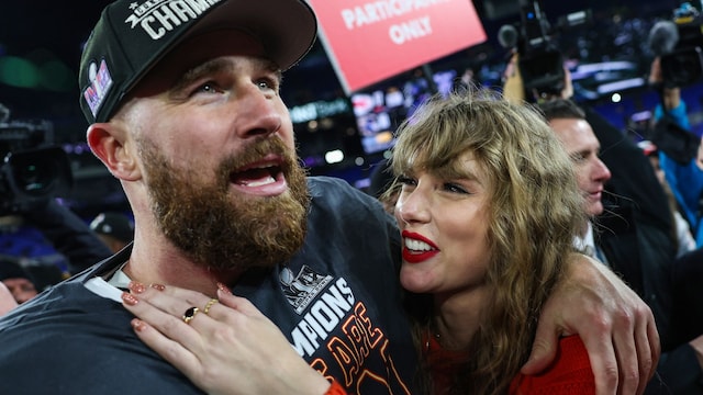 Travis Kelce #87 of the Kansas City Chiefs celebrates with Taylor Swift after defeating the Baltimore Ravens in the AFC Championship Game at M&T Bank Stadium on January 28, 2024