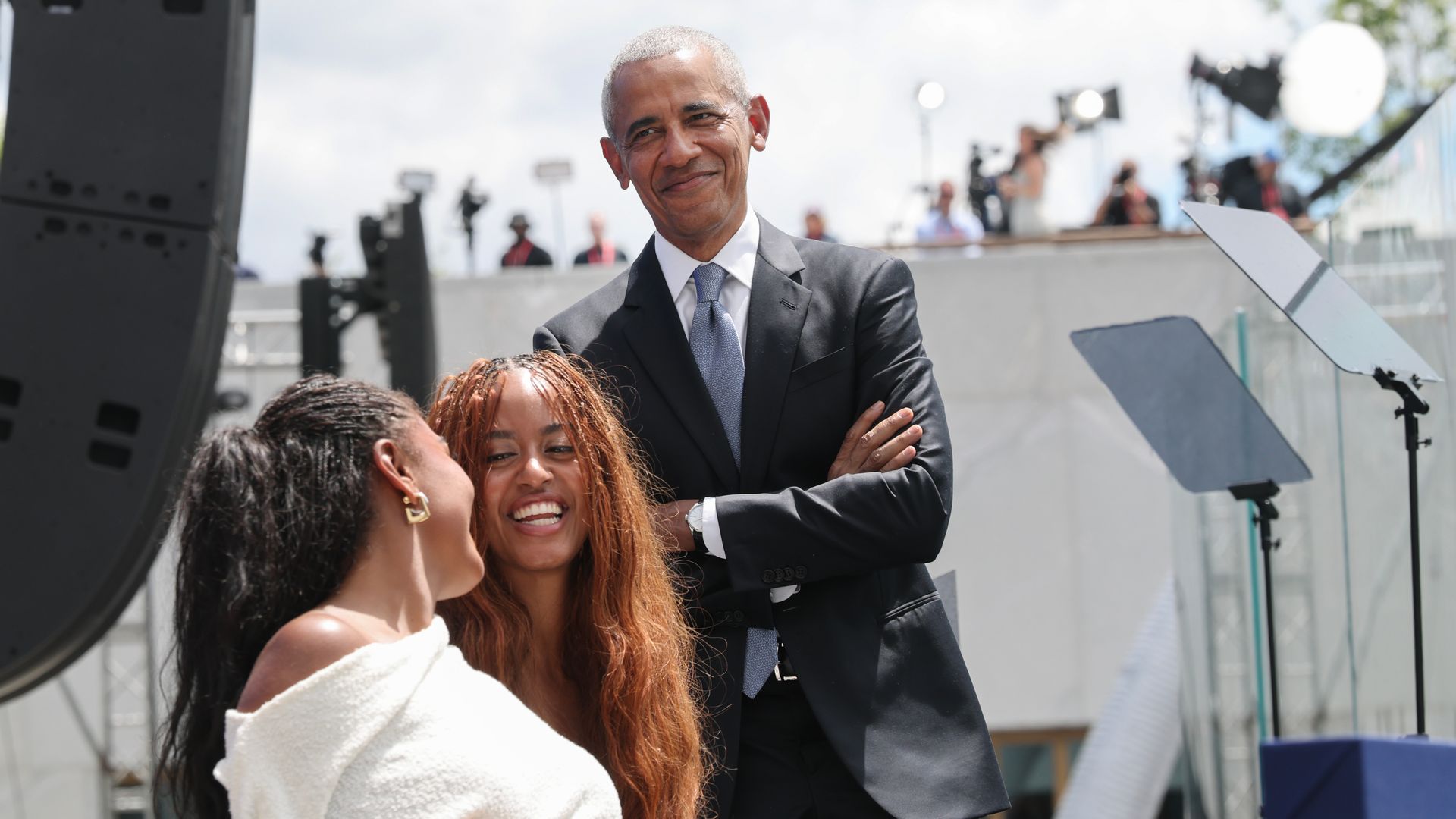 Barack Obama stage alongside his daughters Sasha and Malia