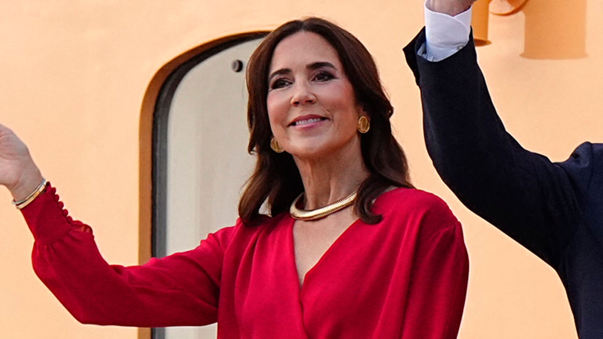 Queen Mary turns heads in a vibrant scarlet dress and romantic cinched look during Denmark's royal summer cruise