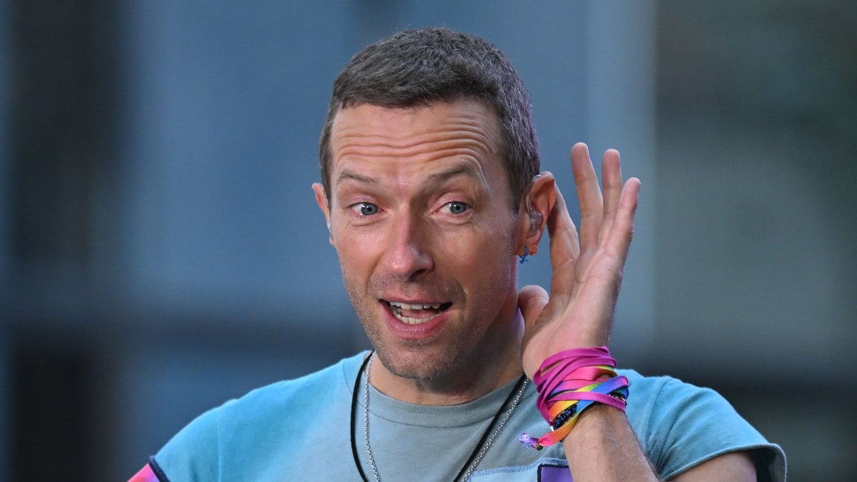 Chris Martin hilariously asks couple if they're "legitimate" after affair scandal