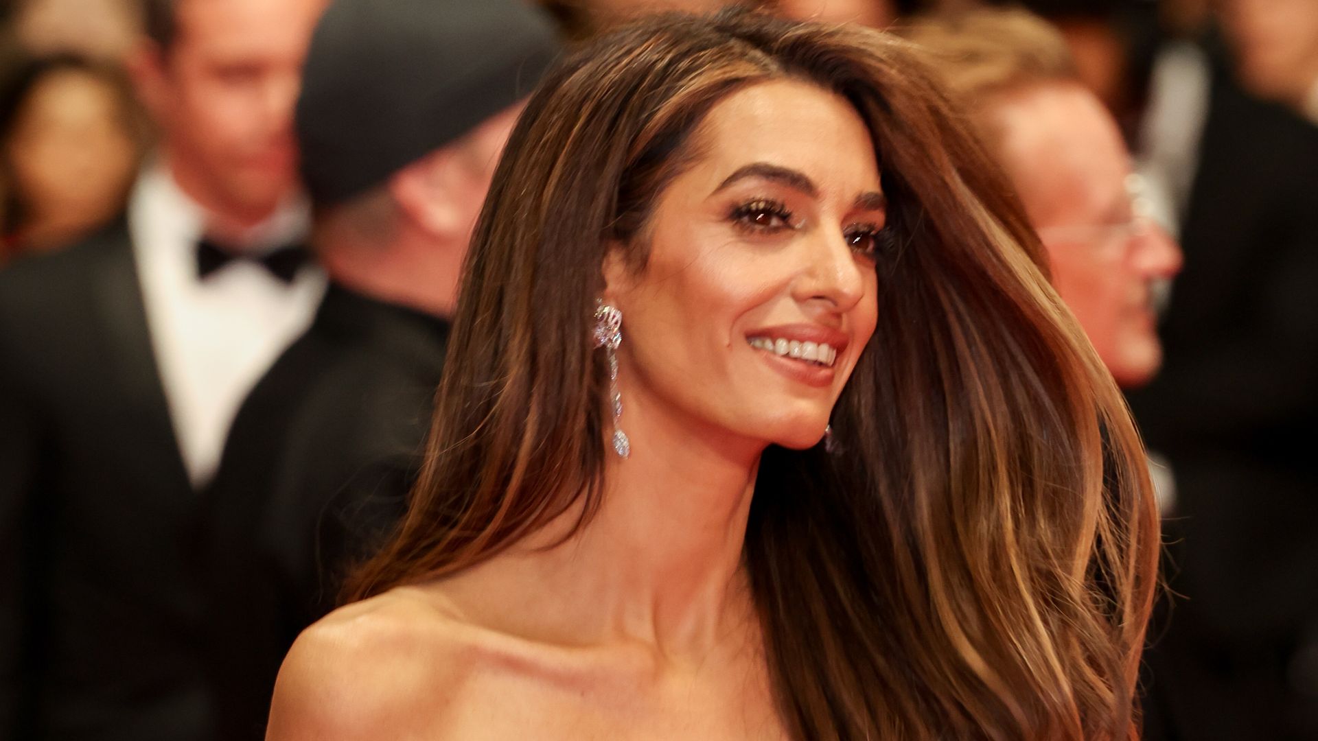 Which sport does Amal Clooney play to stay in shape?