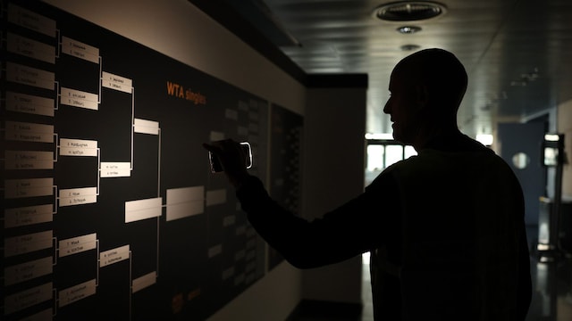  A member of the media checks the tournament draw using the torch on his mobile phone during day seven of the Mutua Madrid Open at La Caja Magica on April 28, 2025 in Madrid, Spain
