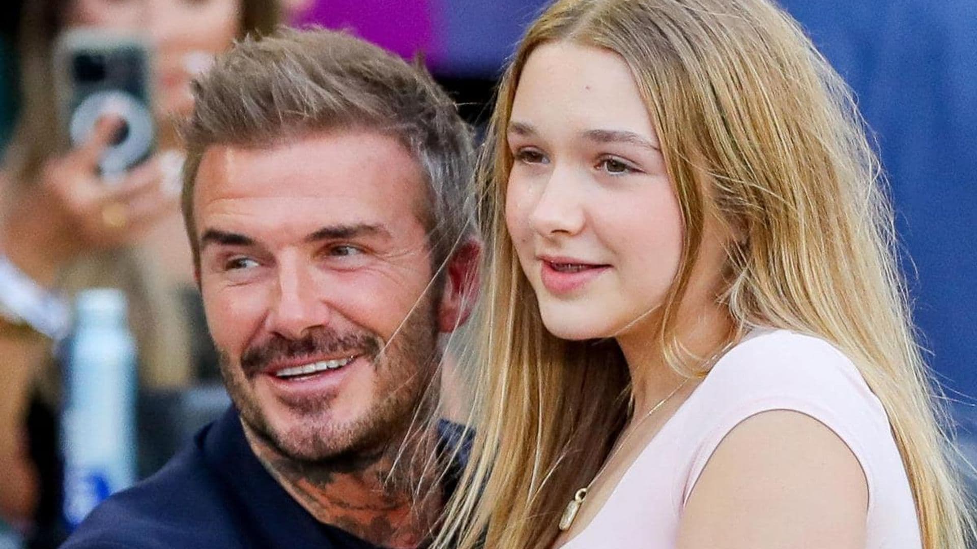 David Beckham and his daughter Harper hug as they watch Inter Miami match