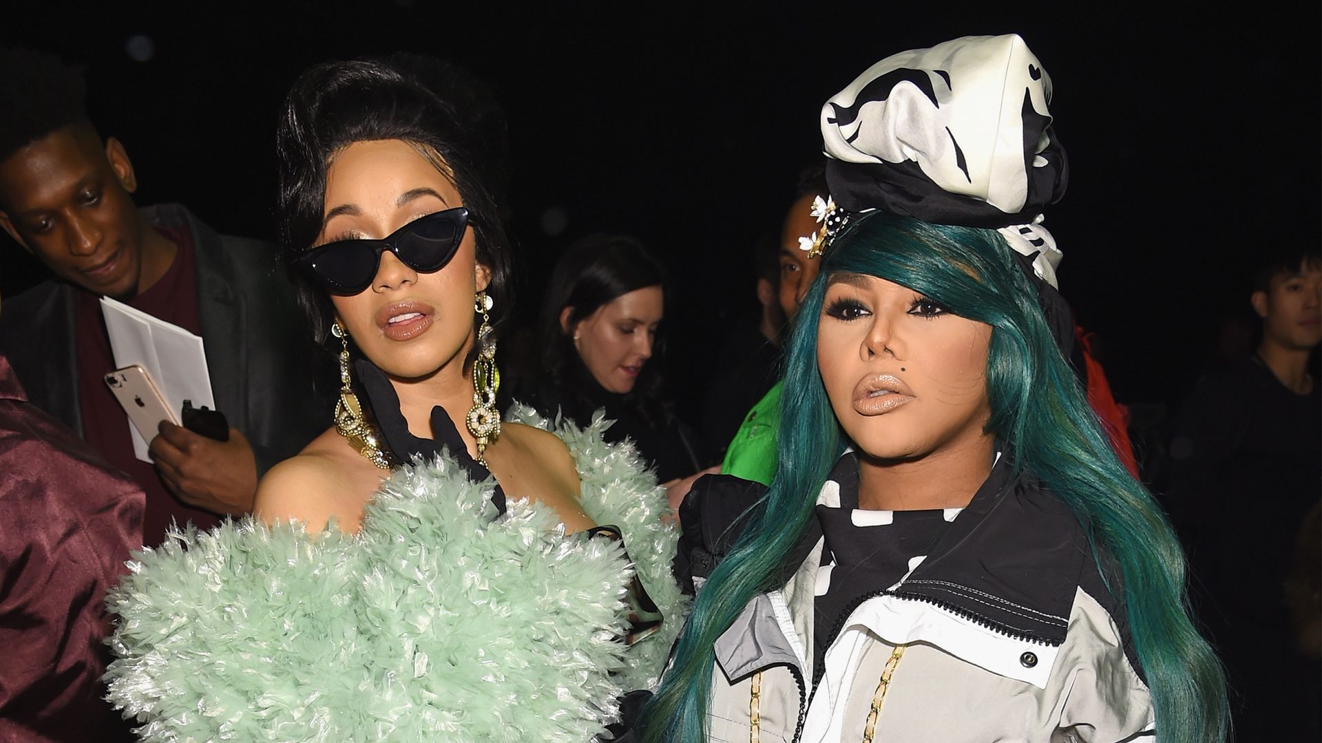 Cardi B (L) and Lil Kim attend the Marc Jacobs Fall 2018 Show at Park Avenue Armory on February 14, 2018 in New York City. (Photo by Dimitrios Kambouris/Getty Images for Marc Jacobs)