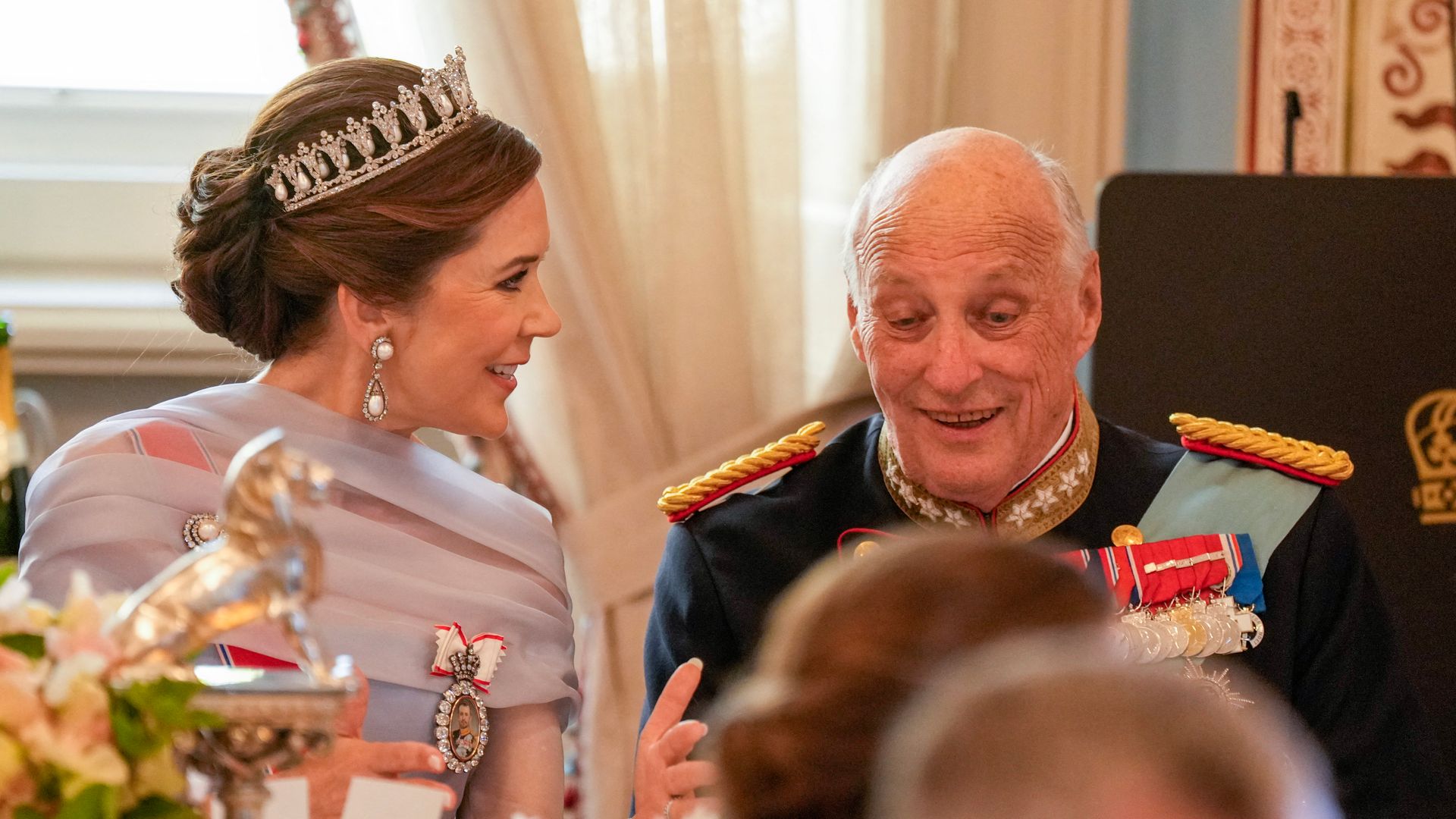 King Harald V of Norway (R) and Queen Mary of Denmark speak during a gala dinner at the The Royal Palace in Oslo, Norway, on May 14, 2024