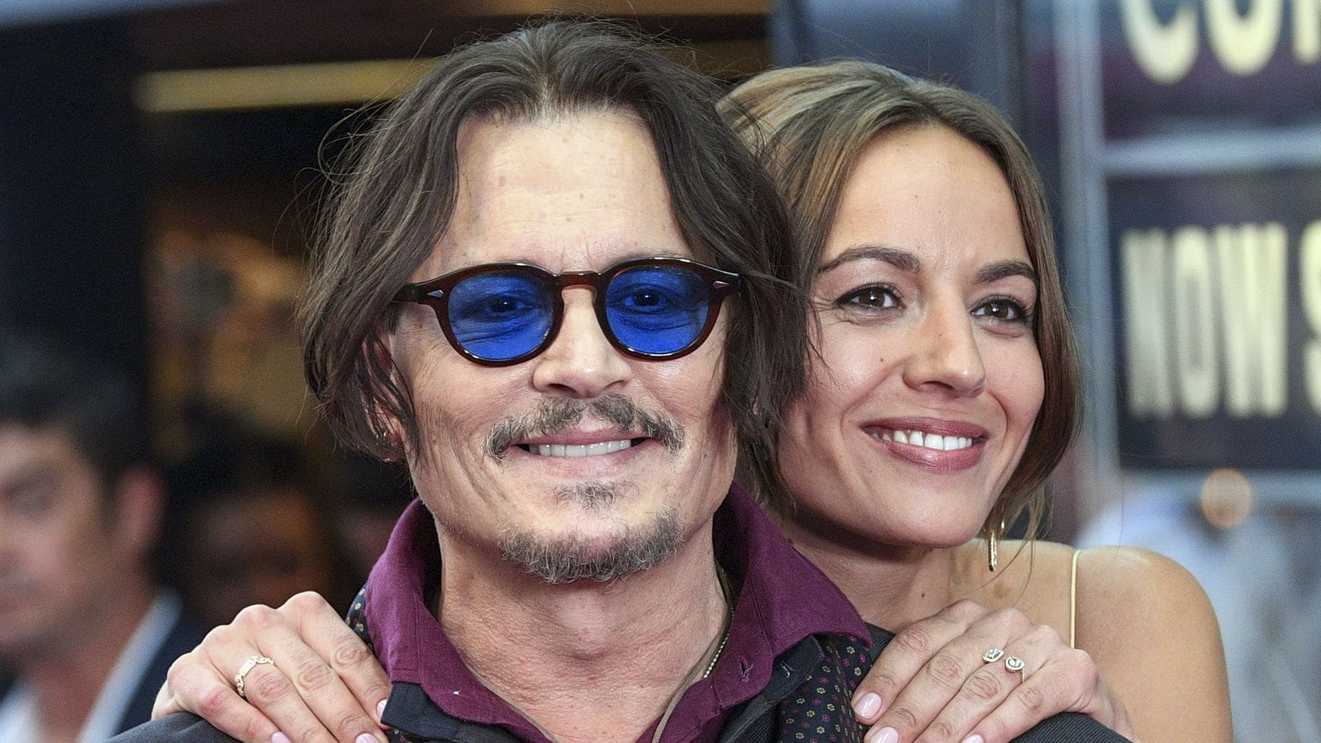 Johnny Depp kisses Antonia Desplat at the premiere of his new movie