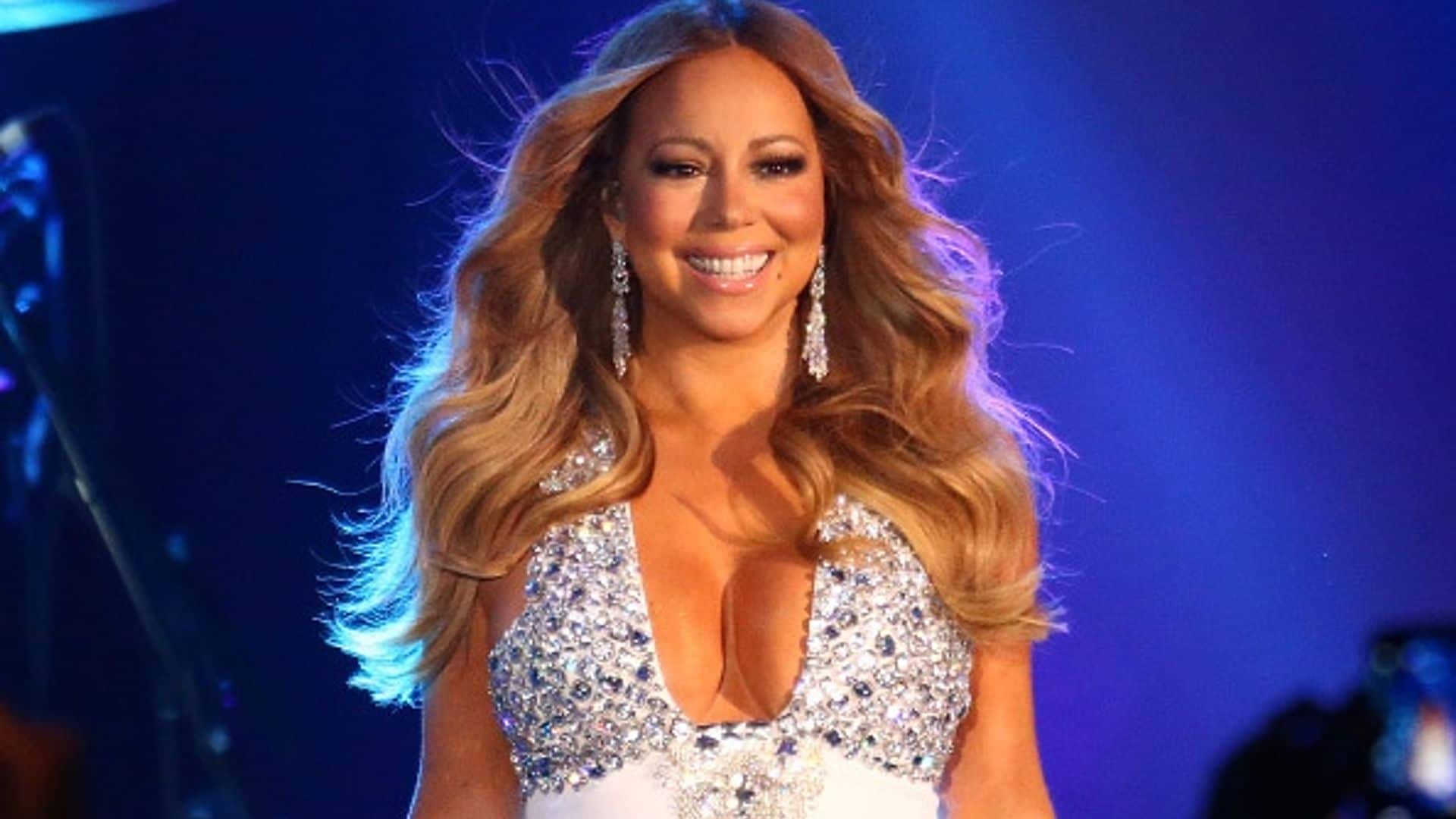 Mariah Carey flaunts her bikini body in a gold swimsuit during her island vacation