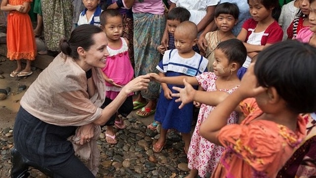 July 30: Angelina Jolie Pitt met with children during a visit to Ja Mai Kaung Baptist refugee camp in Myitkyina, Myanmar.
Photo: Getty Images