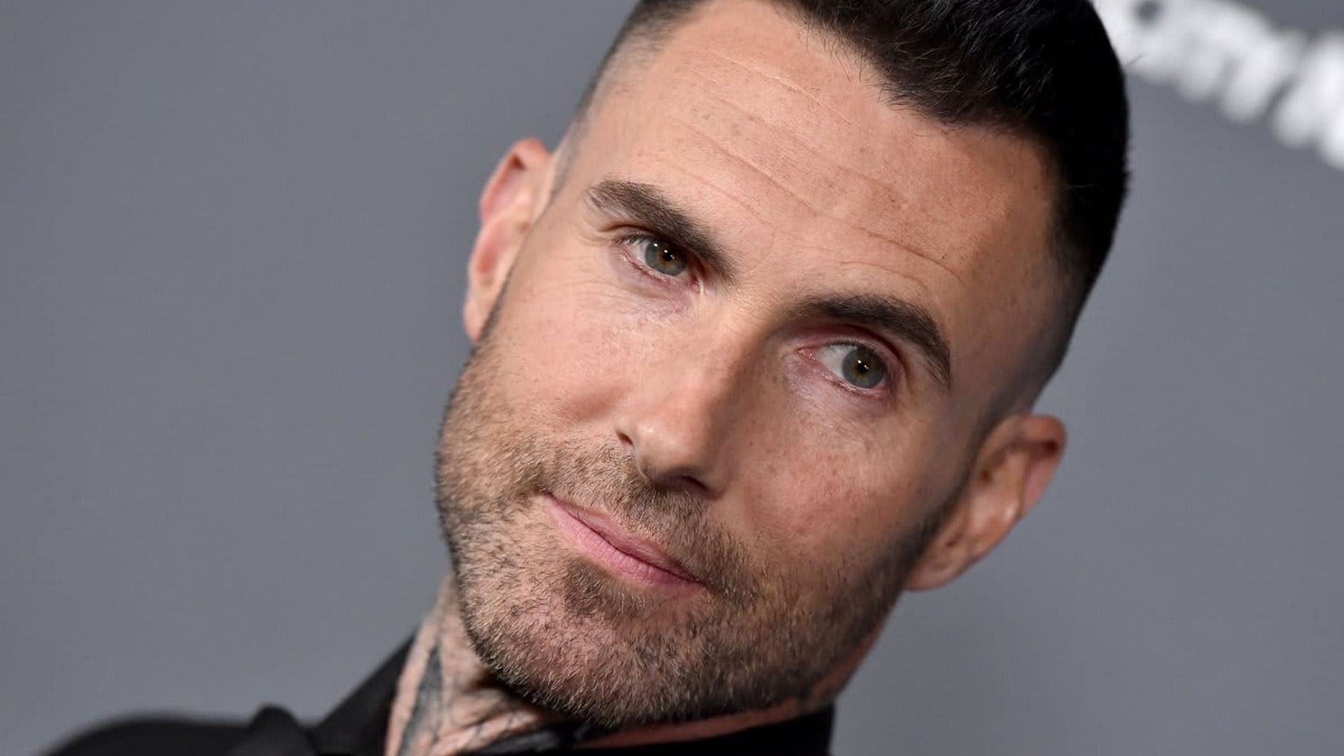 Adam Levine debuts brand new face tattoo--check out his new look!