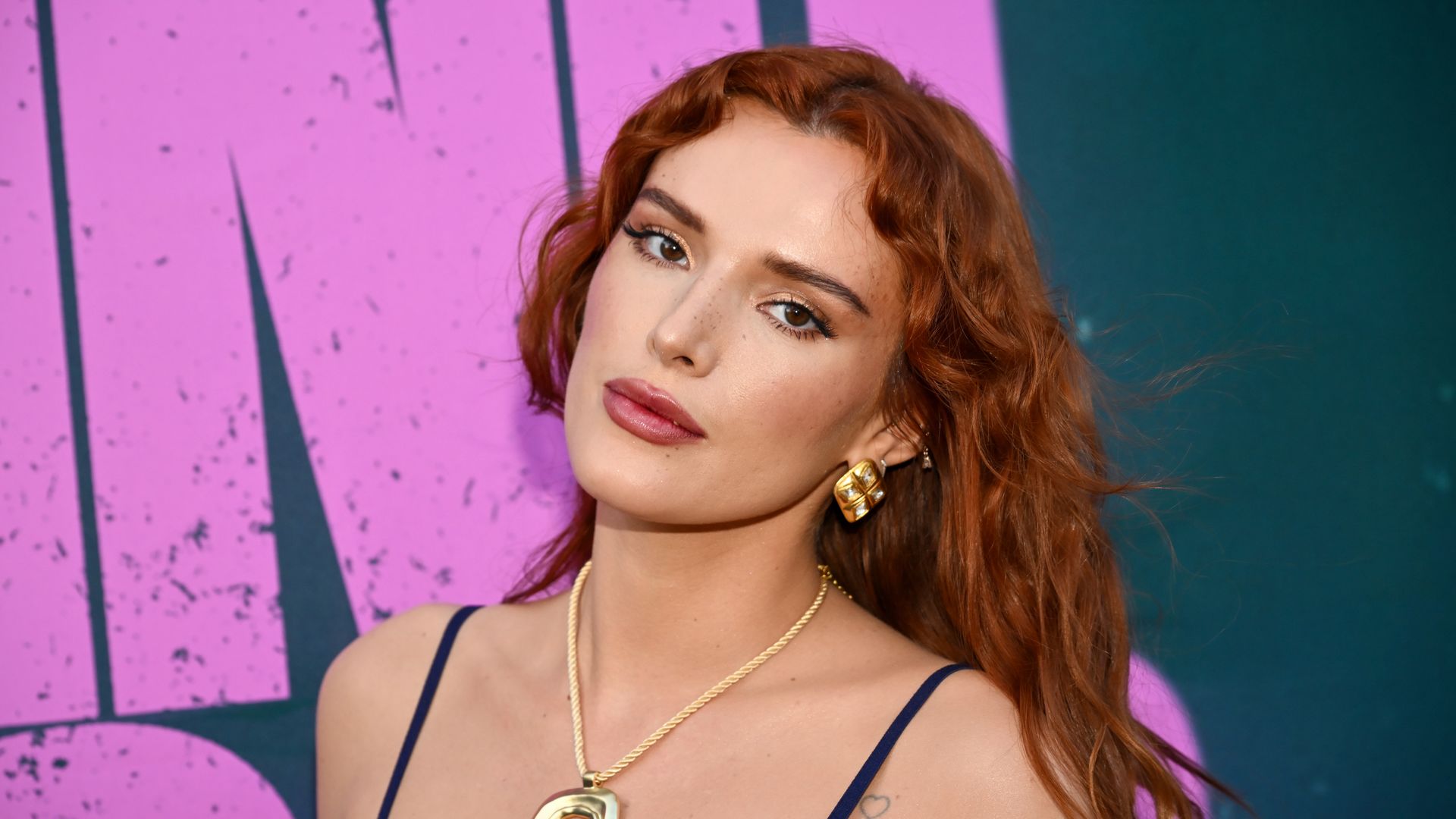 Bella Thorne shows off shimmering green bikini during romantic beach day with fiancé Mark Emms