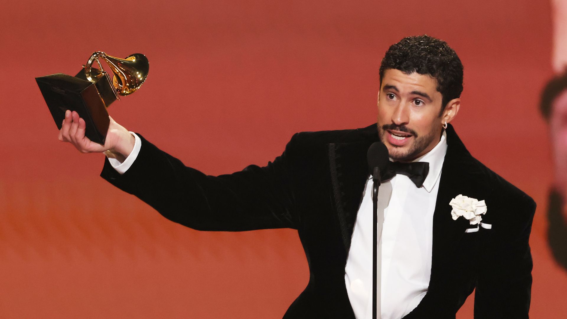 LOS ANGELES, CALIFORNIA - FEBRUARY 01: Bad Bunny accepts the Album of the Year award for "DeBÃ TiRAR MÃ¡S FOToS" onstage during the 68th GRAMMY Awards at Crypto.com Arena on February 01, 2026 in Los Angeles, California.  (Photo by Kevin Winter/Getty Images for The Recording Academy) 