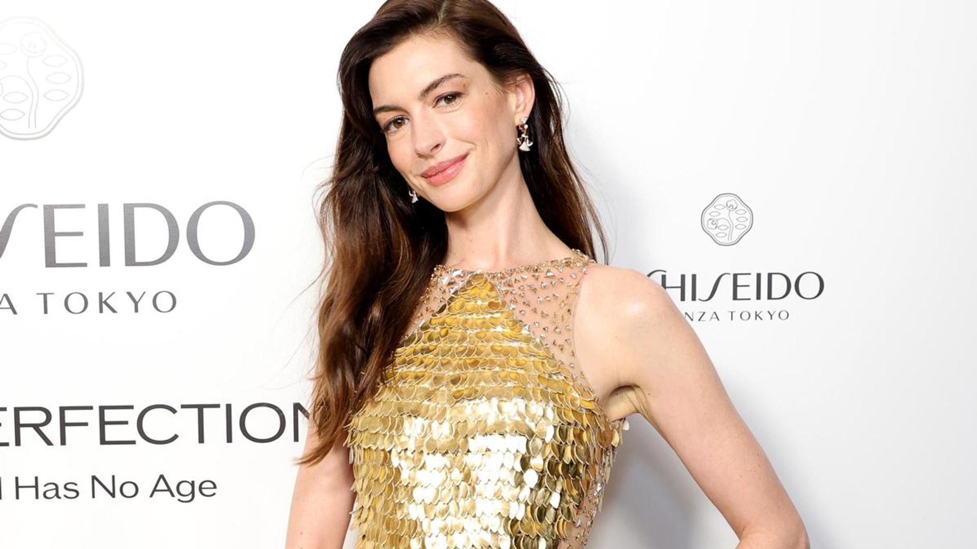 anne hathaway gold dress Anne Hathaway (@annehathaway) gives us another maternity style moment in  New York City while promoting her upcoming film 'The Odyssey'. She steps  out in a gold velvet tube dress by Lela Rose (@
