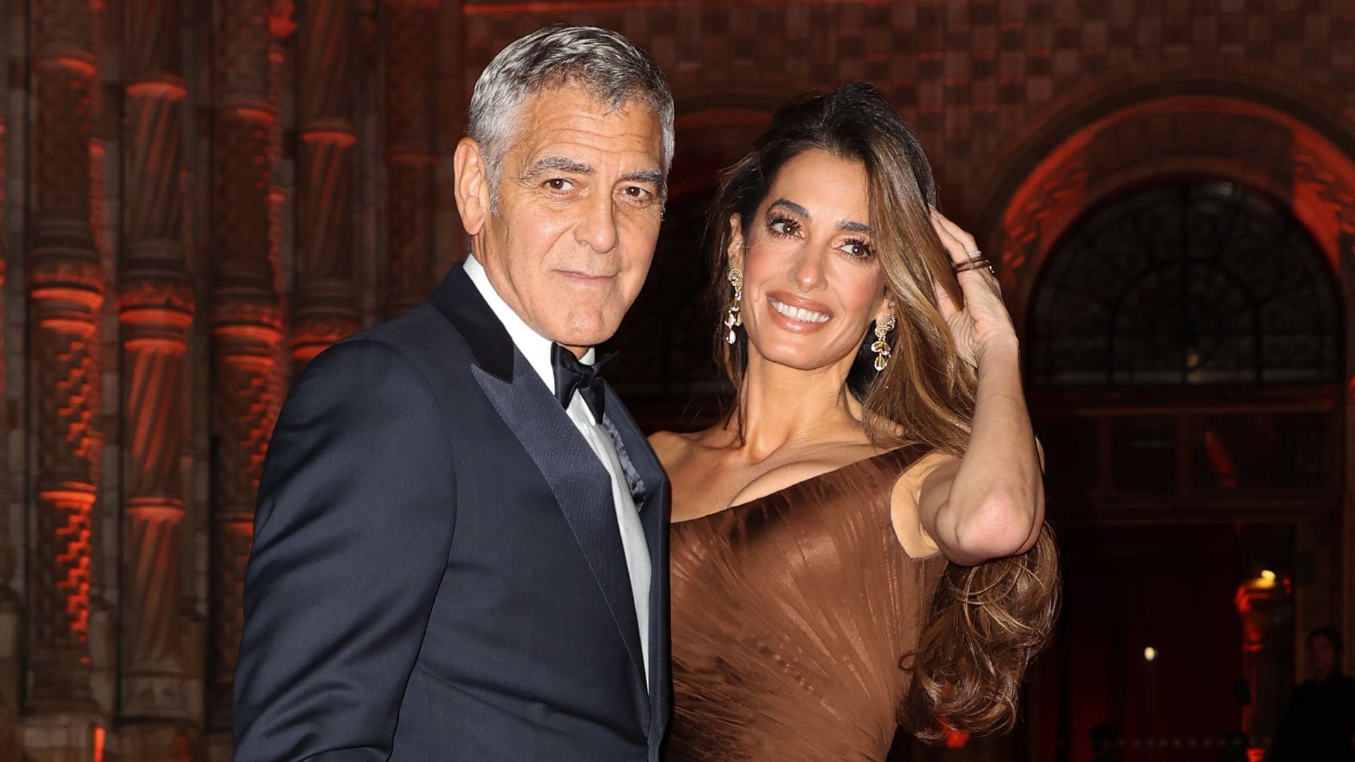 Amal Clooney’s hot pink minidress and gold pointed-toe heels are the perfect party look