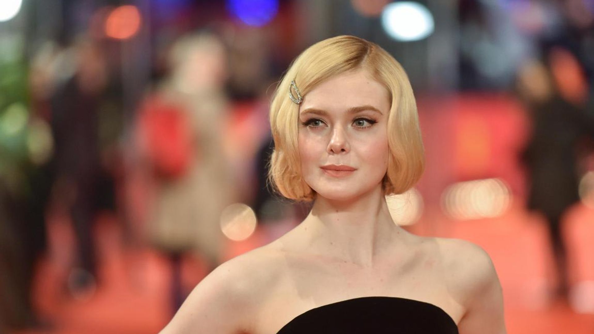 Elle Fanning dresses up as Brad Pitt and we can’t stop staring at the beard braids!