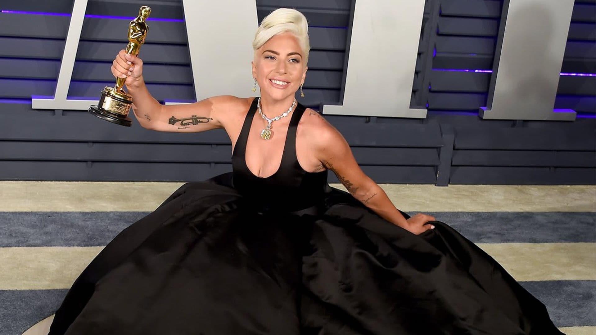 Lady Gaga looked like a boss strutting in a boa made up of $100 bills