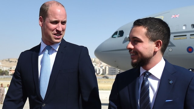 AMMAN, JORDAN - JUNE 24: Prince William, Duke of Cambridge is greeted by the Crown Prince Hussein of Jordan (R) after arriving at Marka Airport at the start of his Middle East tour on June 24, 2018 Amman, Jordan. Prince William's five-day tour of the region is his most high-profile foreign trip and the first official visit to Israel and the Occupied Palestinian Territories by a member of the monarchy on behalf of the Government. (Photo by Joe Giddens-Pool/Getty Images)