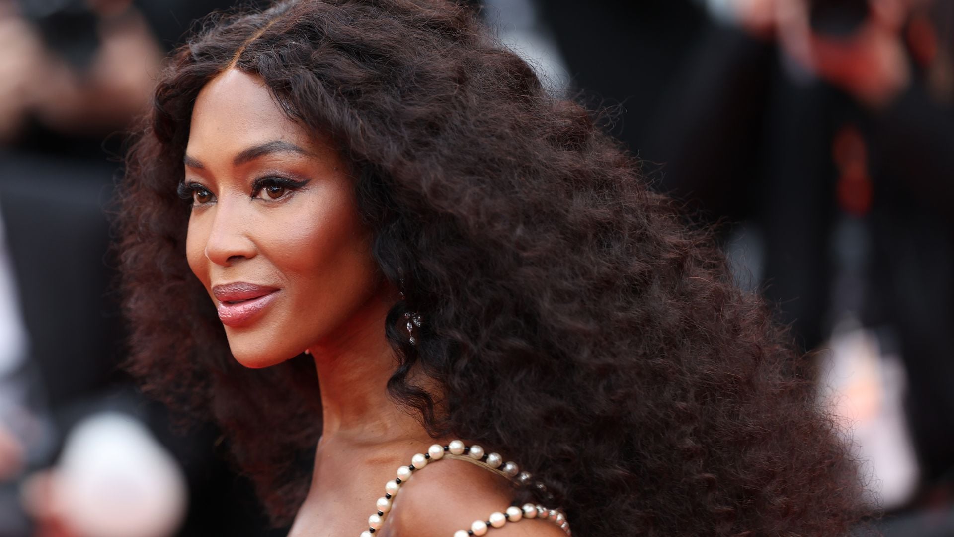 Naomi Campbell, 55, turns up the heat in Ibiza in pink string bikini and statement jewelry