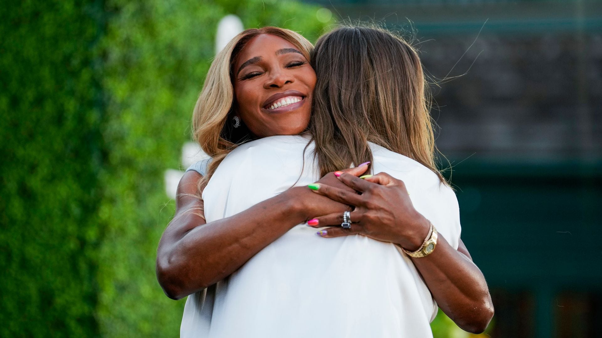Serena Williams embraces Maria Sharapova during the 2025 Induction Celebration weekend at the International Tennis Hall of Fame