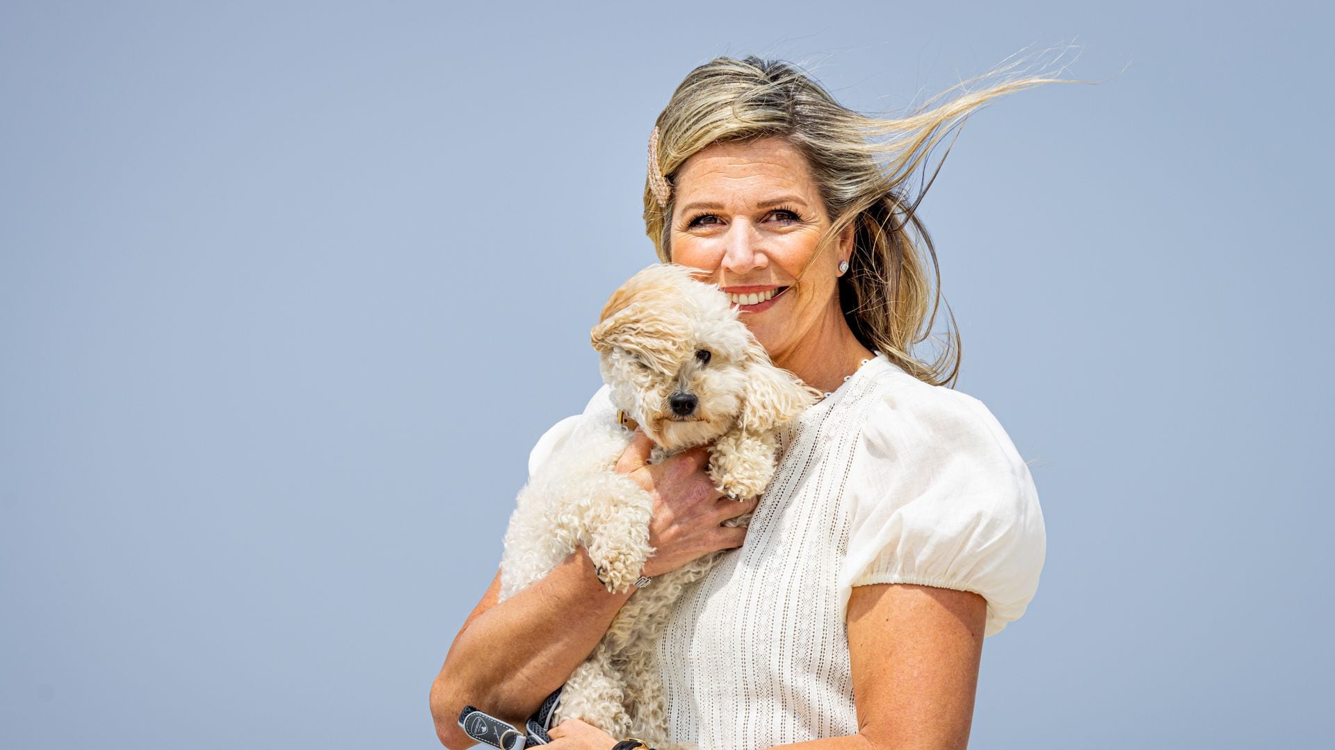 Queen Maxima of The Netherlands with her dog Mambo