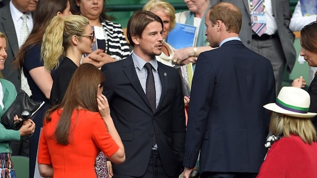 Talking about fatherhood? Prince William and Josh chat in the stands.
Photo: Getty Images