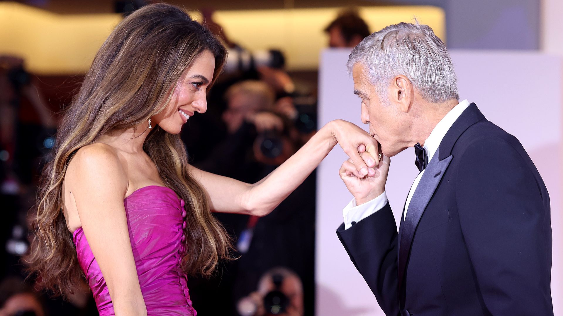 Amal Clooney and George Clooney attend the "Jay Kelly" red carpet during the 82nd Venice International Film Festival on August 28, 2025 in Venice, Italy. 