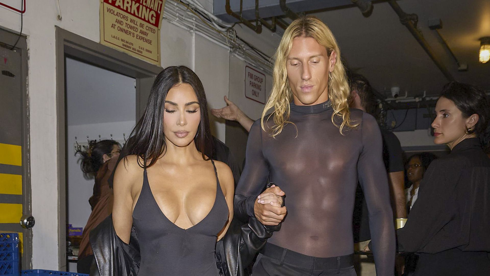 De Saint Sernin coordinated with Kardashian's dark color palette in an all-black outfit 