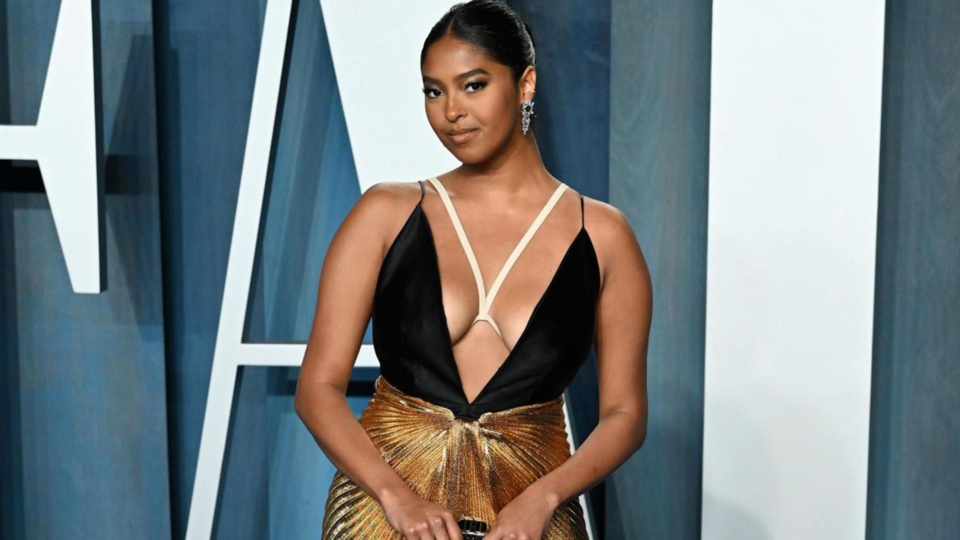 Natalia Bryant steals the show in plunging gold gown at Vanity Fair Oscar party