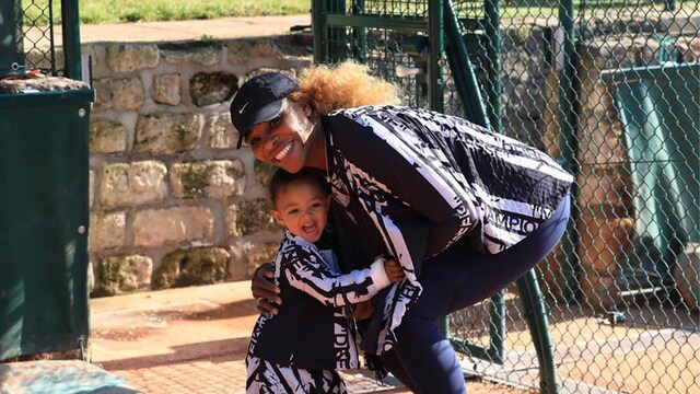 Serena Williams and daughter Olympia posing together