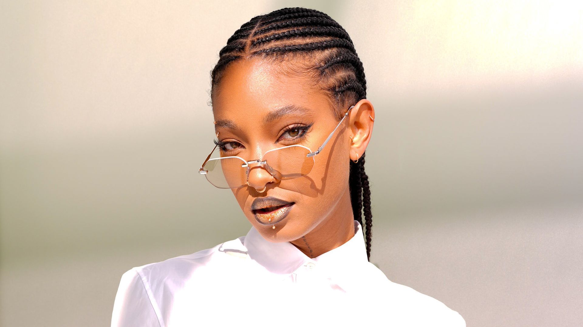Willow Smith turns heads in daring pink mini dress with dramatic draped sleeve at special music event