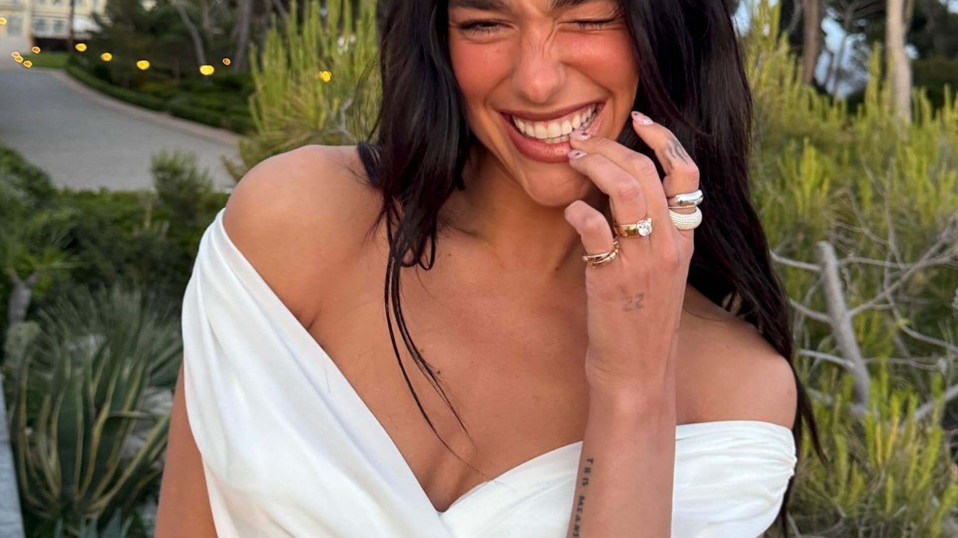 Dua Lipa poses in white bridal dress amid engagement to Callum Turner