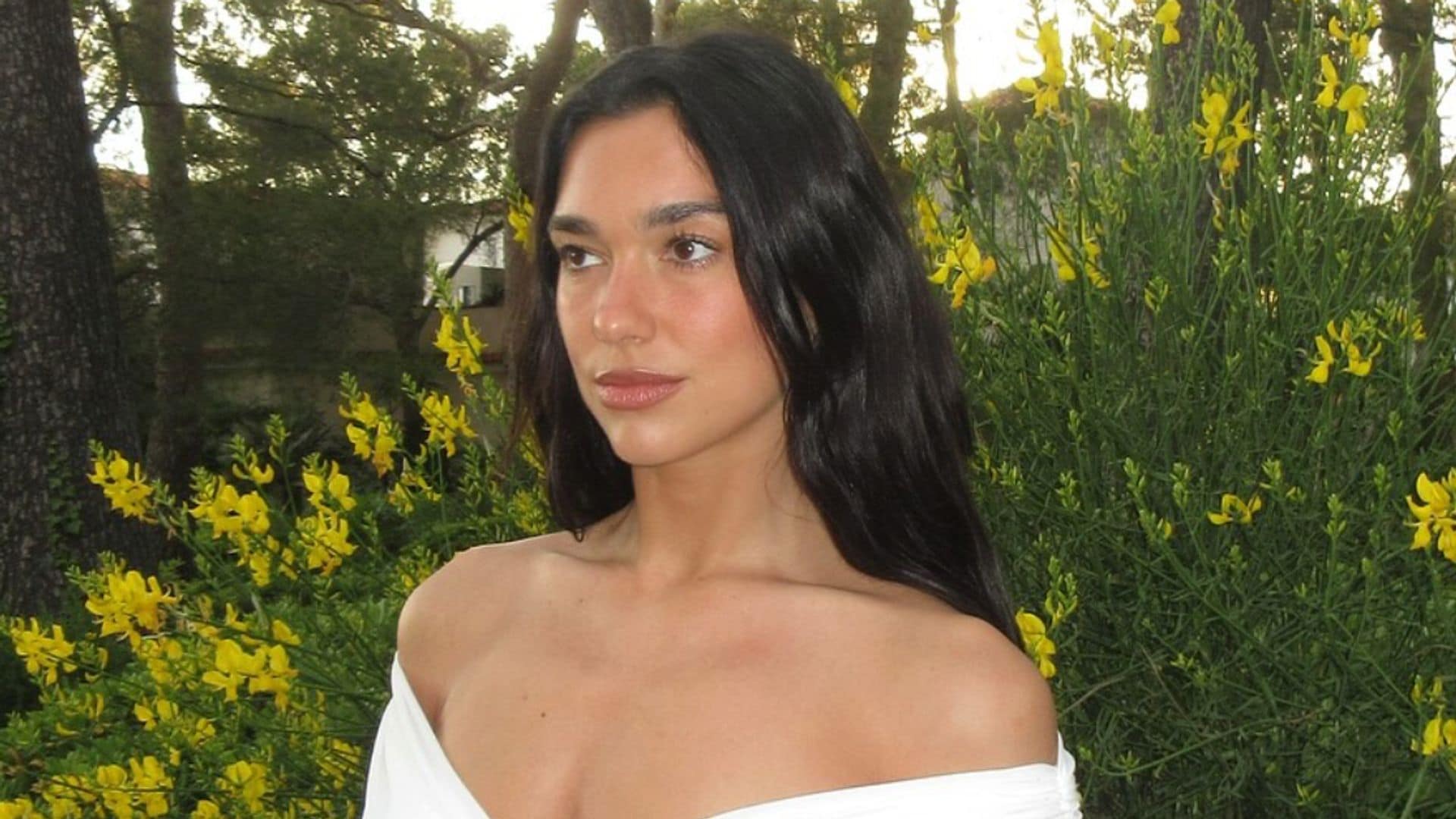 Dua Lipa poses in bridal white dress amid engagement to Callum Turner