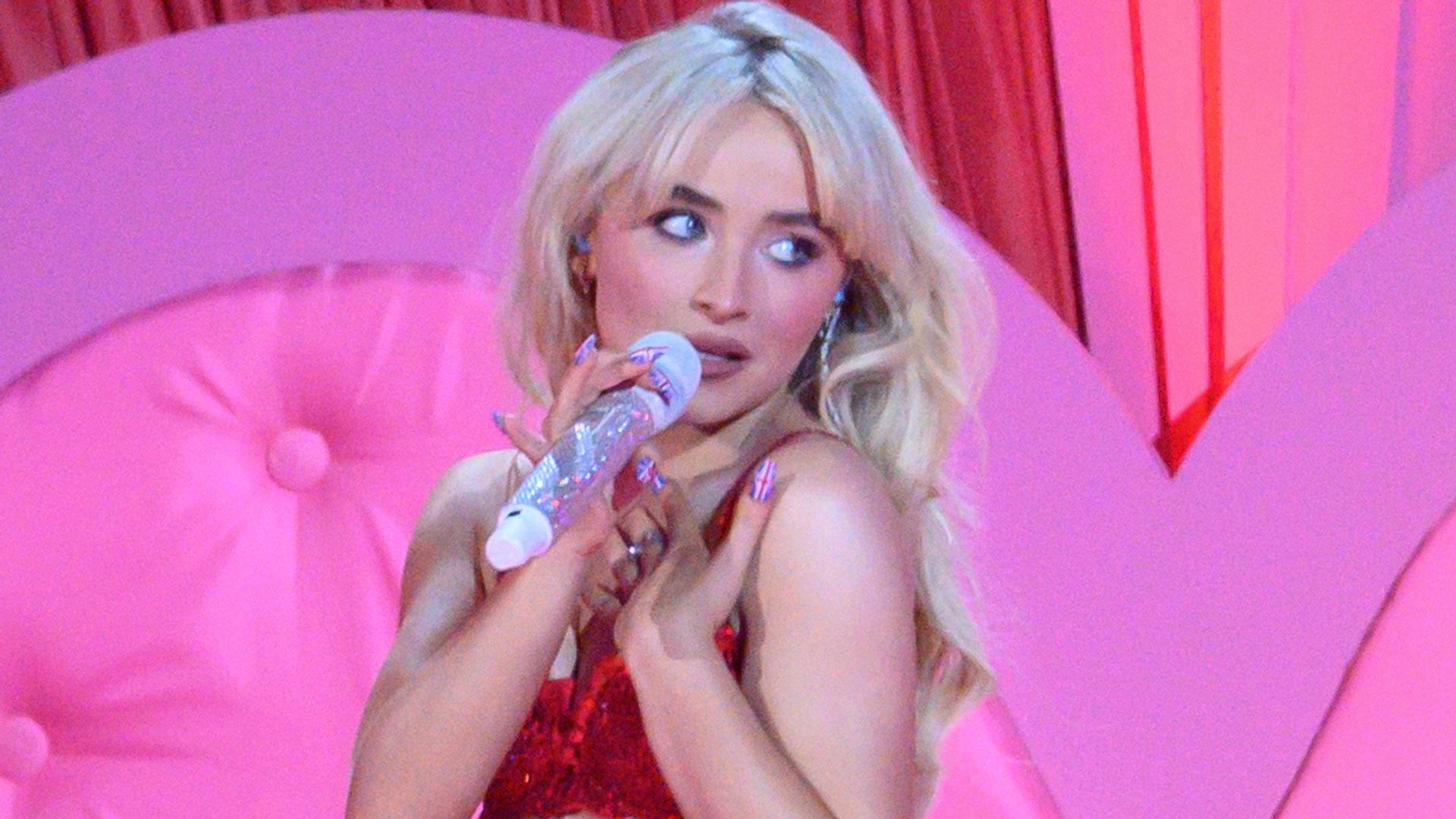 Sabrina Carpenter poses in sheer white dress in Bogot as her signature soft, corseted style takes center stage Sabrina Carpenter poses in sheer white dress in Bogot as her signature soft, corseted style takes center stage