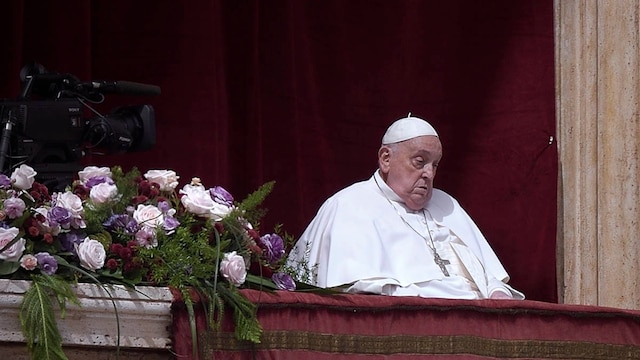 Pope Francis during the impartation of the 'Urbi et Orbi' blessing and wishes "good Easter" from the balcony of St. Peter's Basilica