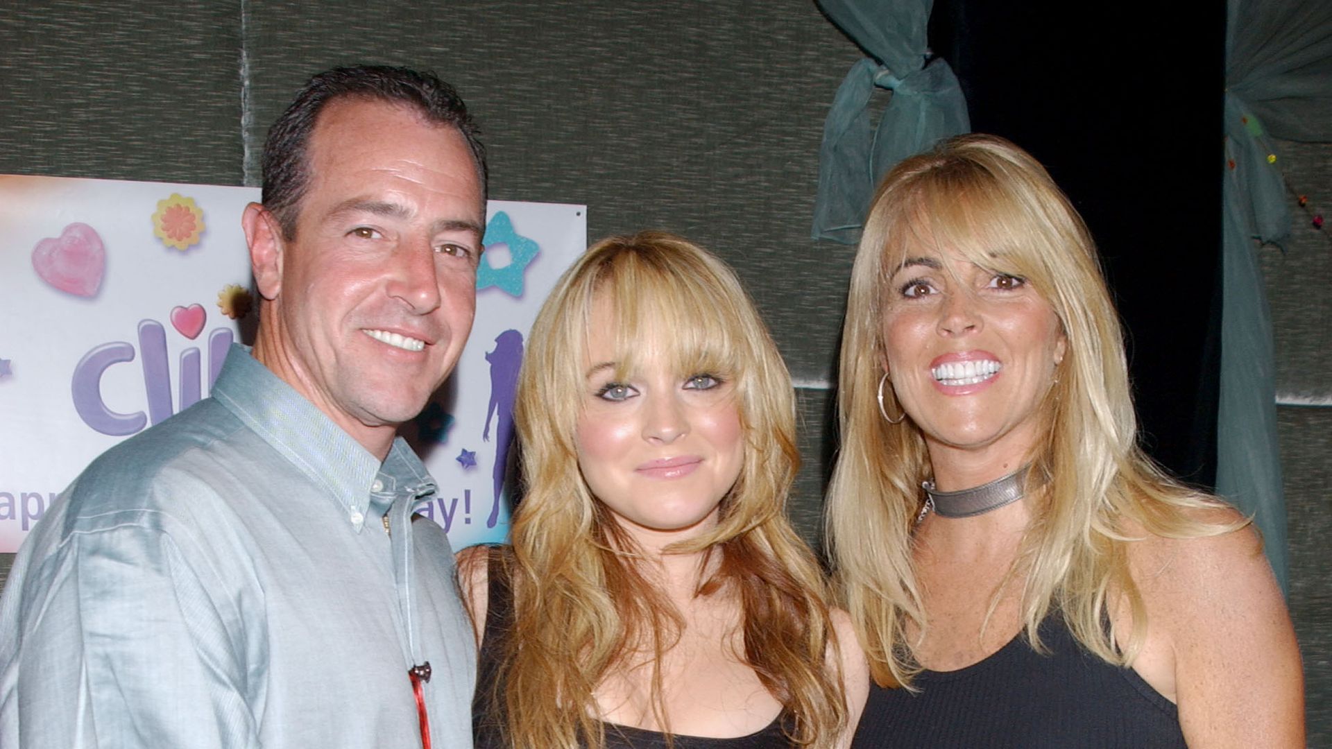 Lindsay Lohan with her father Michael Lohan and mother Dina Lohan (Photo by Bill Davila/FilmMagic)