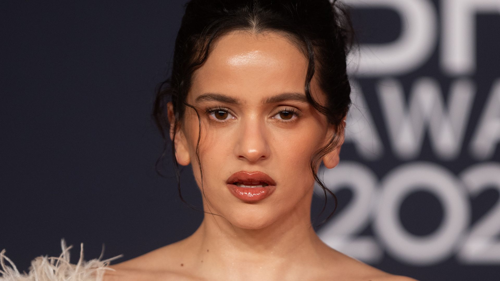 Rosalía turns heads in three bold red carpet looks: From dramatic feathers to a fiery red dress