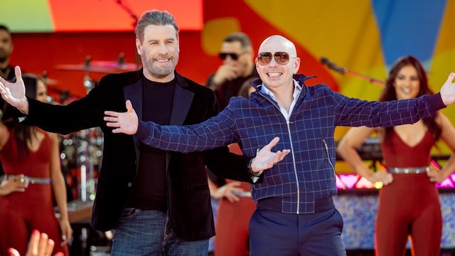 John Travolta hits the dance floor in Pitbull's 3 to Tango music video