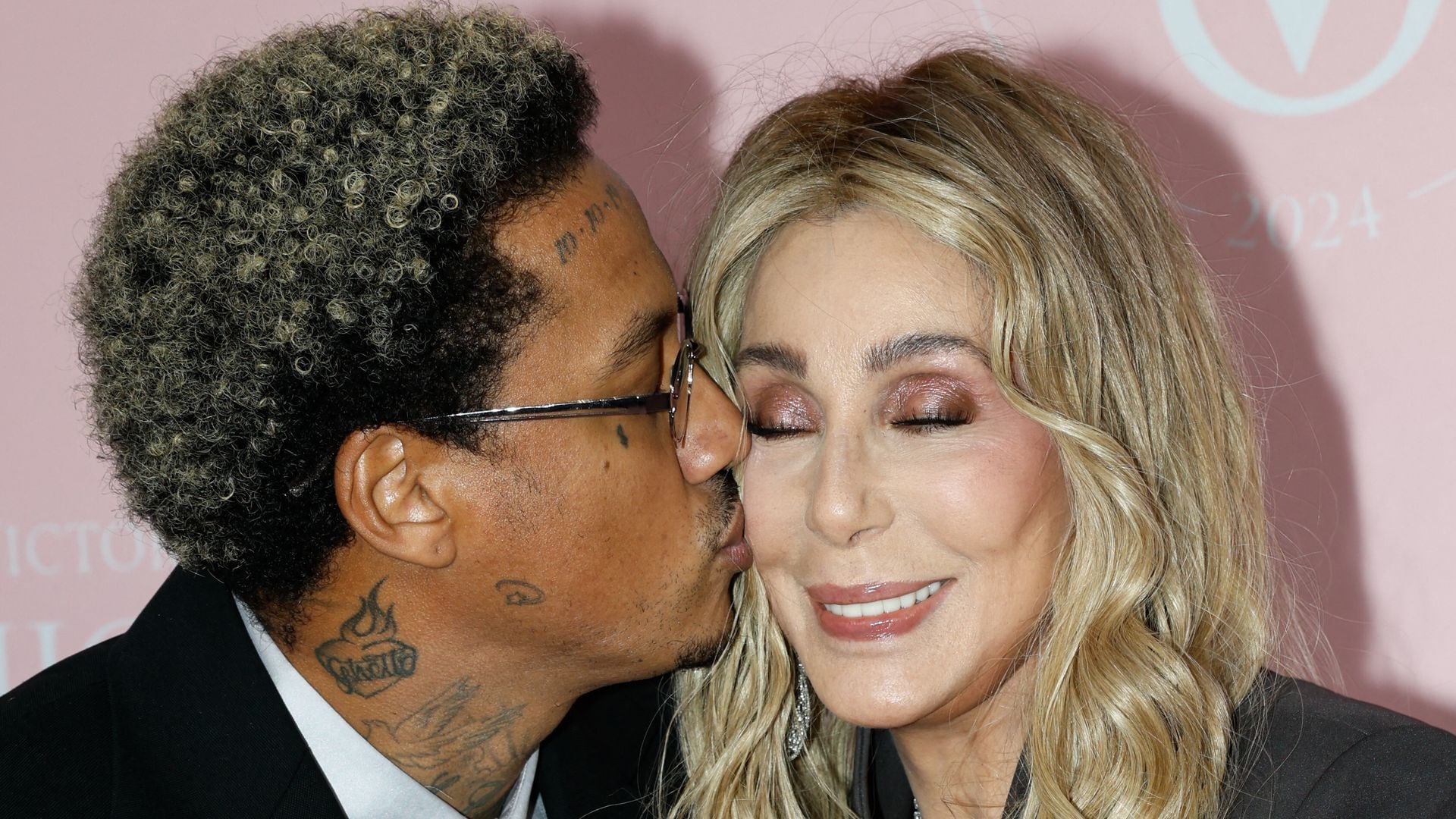 Rapper Alexander Edwards and singer Cher attend Victoria's Secret Fashion Show at Duggal Greenhouse at the Brooklyn Navy Yard in Brooklyn, New York on October 15, 2024. (Photo by kena betancur / AFP) (Photo by KENA BETANCUR/AFP via Getty Images)