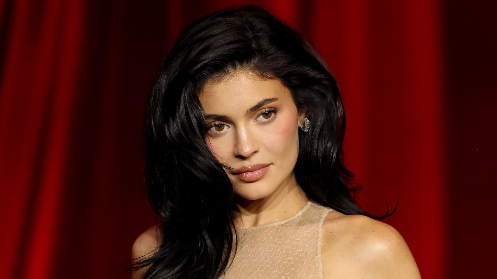 Kylie Jenner turns up the heat in a tiny hot pink bikini