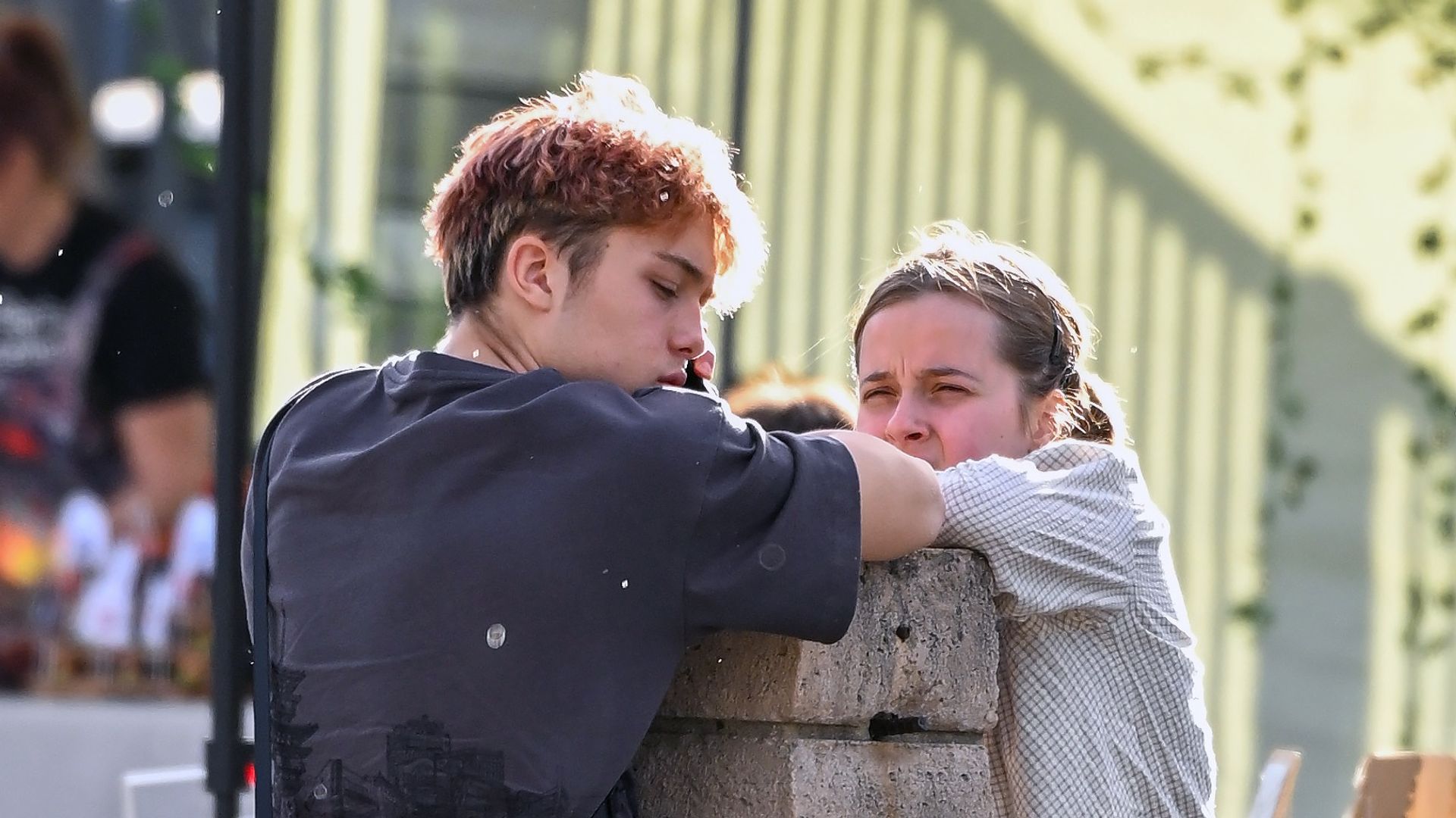 Vivienne was seen taking selfies with her twin brother and they were seen both leaning on a brick pillar.