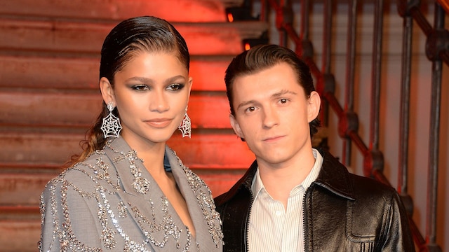 Zendaya and Tom Holland pose at a photocall for "Spider-Man: No Way Home" at The Old Sessions House on December 5, 2021 in London, England.