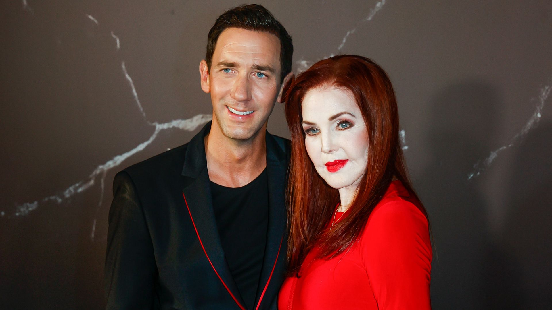Priscilla Presley turns heads in vibrant red gown during rare appearance at glamorous Mallorca event